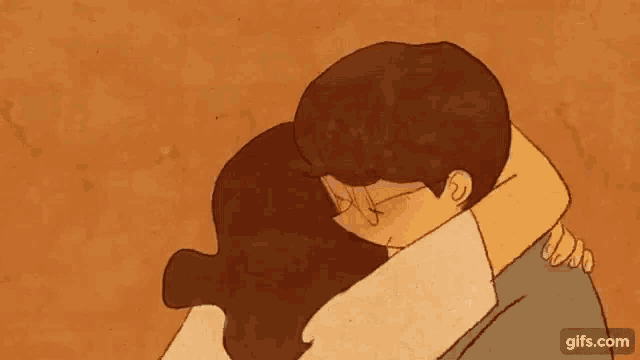 a man and a woman are hugging each other .