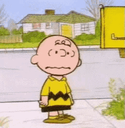 a cartoon of charlie brown standing on a sidewalk and saying `` good grief '' .